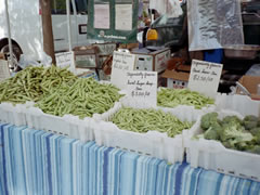 Photo shows green beans and other organic produce.