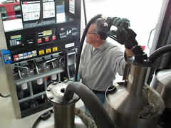Picture of inspector checking a gasoline pump.