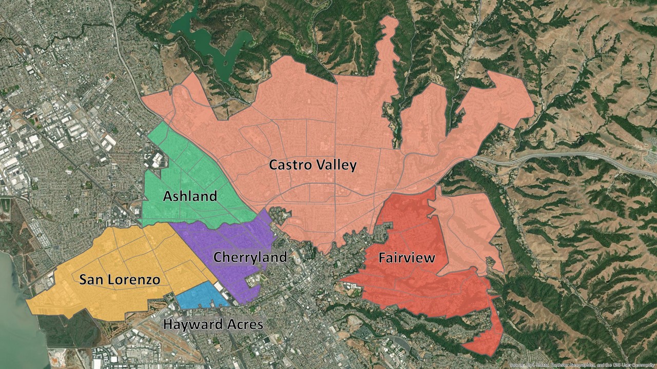 This is an aerial map of Urban Unincorporated Alameda County. Satellite imagery is the background of the map, showing the East Bay Hills to the east and San Francisco Bay to the west. In the center of the map are the communities of Ashland, Castro Valley, Cherryland, Fairview, Hayward Acres, and San Lorenzo. Each is highlighted a different color to distinguish them from the rest of Alameda County.