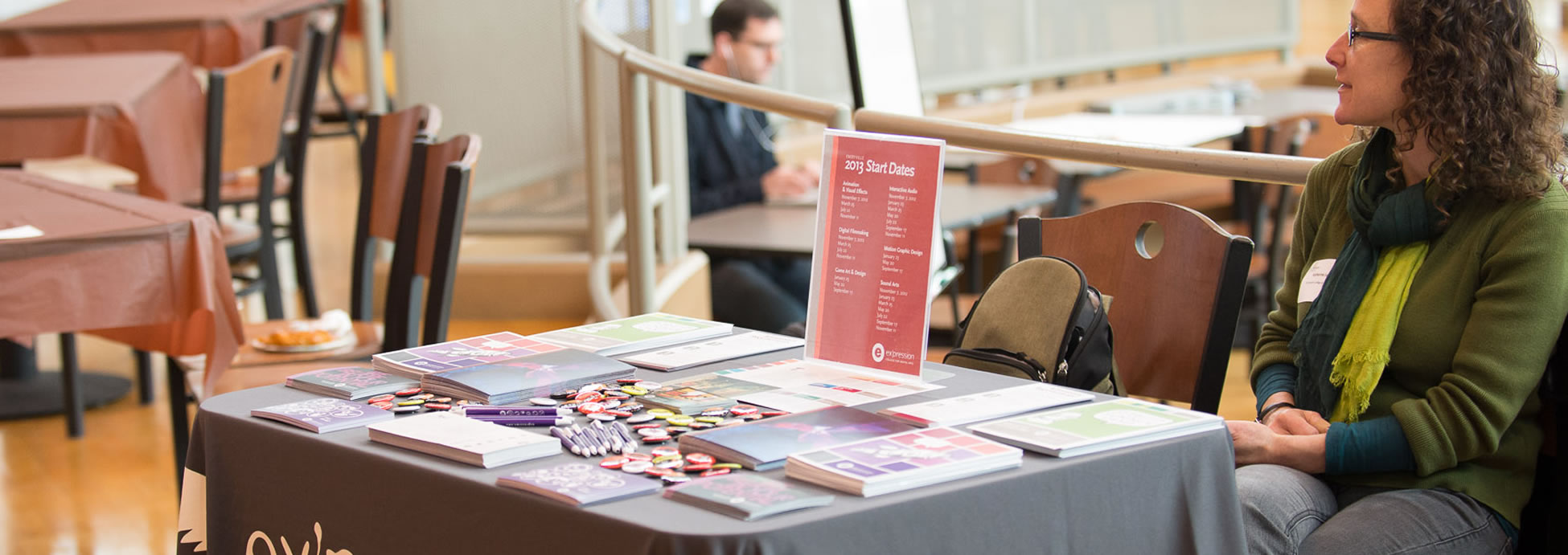 Photo of hackathon sponsor at their sponsor table.