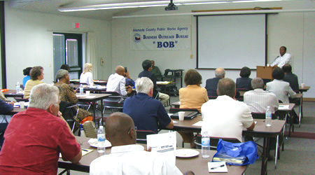 photo of ACPWA Director Daniel Woldesenbet speaks to BOB attendees.