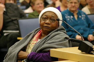 An elderly woman speaks at the Alameda County Board of Suvervisor meetings on the Human Impact Budget.