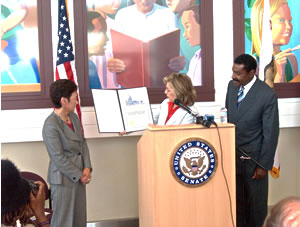 Senator Barbara Boxer presents Conservation Champion Award to Supervisor Keith Carson and County Administrator Susan Muranishi in front of one of the Juvenile Justice Center's inspiring artwork displays. Photo credit: Rahman Batin