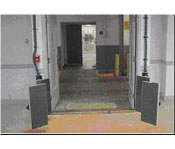 Photo of the scanners on either side of doorway that scan bags as they are delivered.