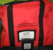 Photo of the red bag that contains the assets from the precinct.