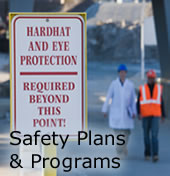 Safety Plans & Programs - Photo of two workers in hard hats..
