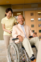 woman with man in wheelchair