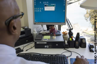 Photo of an employee at their computer.