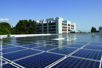 Photo of solar panels atop a county facility.