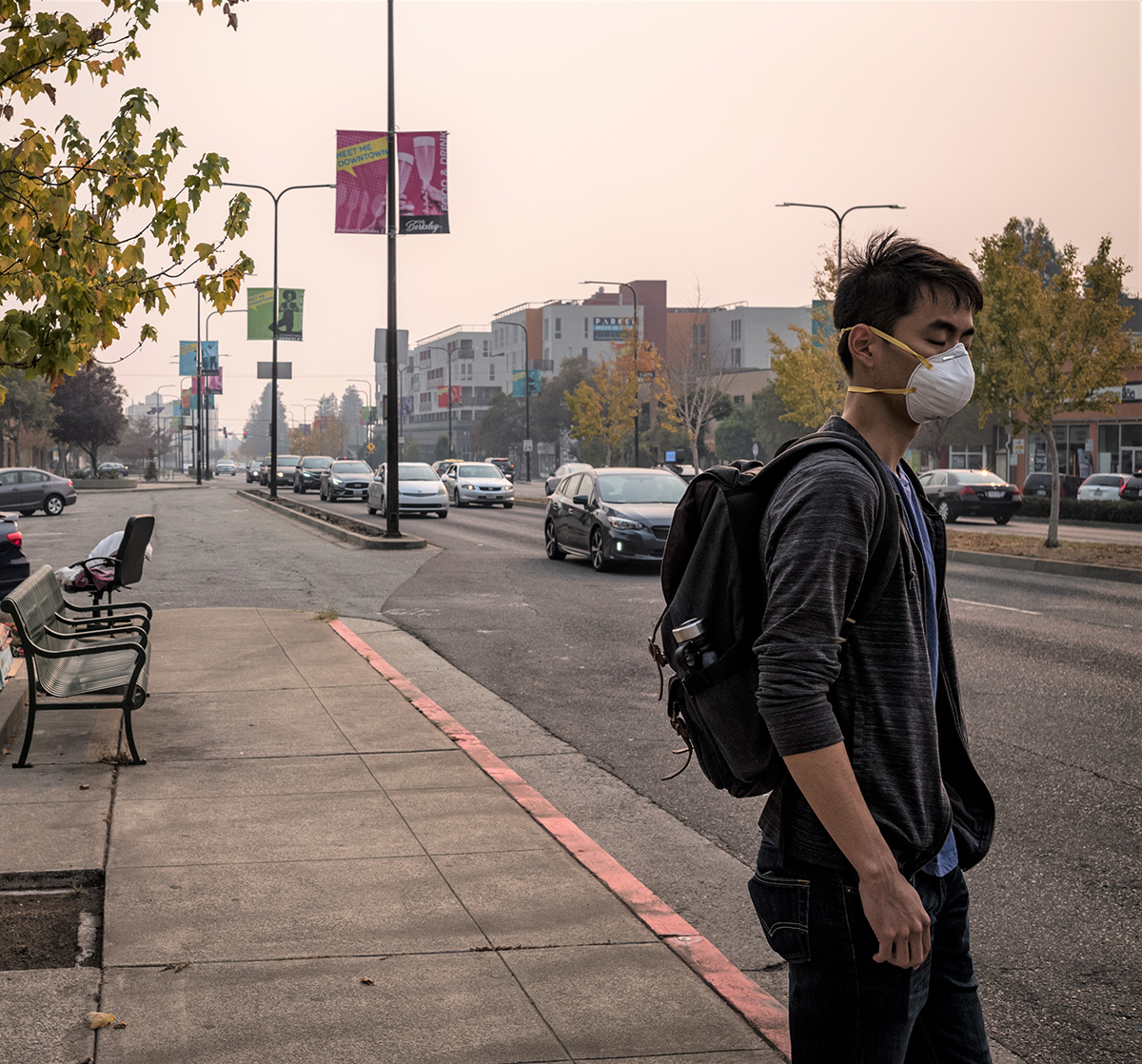 A man in Berkeley wears an N95 mask during the Butte County fire.